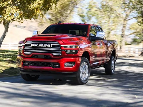 red 2026 RAM 2500 truck driving down the road