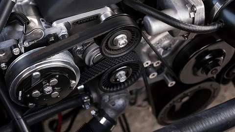 car engine getting an oil change at the Huffines CDJR Plano service department in Plano, TX