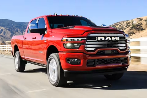 red RAM 2500 truck driving down the road
