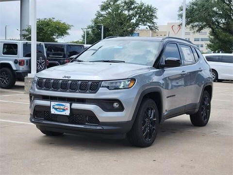 grey 2025 Jeep Compass SUV parked at the Huffines CDJR Plano dealership in Plano, TX