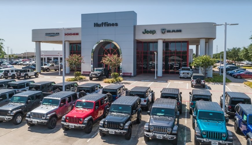 exterior of the Huffines CDJR Plano dealership in Plano, TX