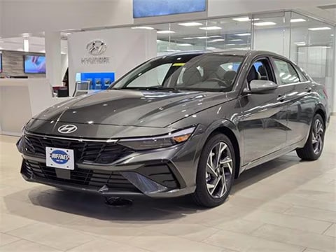 grey 2026 Hyundai Elantra sedan parked at the Huffines Hyundai Plano dealership in Plano, TX