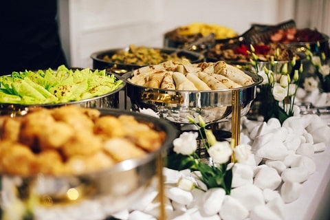 a table full of catered food at an event in Plano, TX
