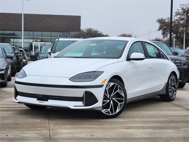 white 2025 Hyundai IONIQ 6 electric sedan parked at the Huffines Hyundai Plano dealership in Plano, TX