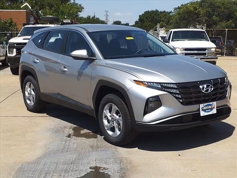 silver 2024 Hyundai Tucson SUV parked at the Huffines Hyundai Plano Hyundai dealership in plano, tx