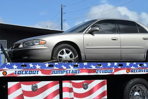 person getting their car towed in Plano, tx