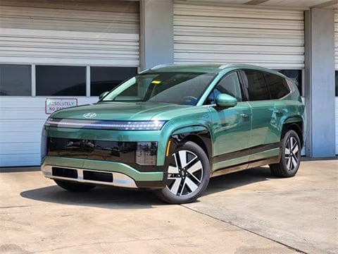 green 2026 Hyundai Ioniq 9 electric SUV parked at the Huffines Hyundai Plano dealership in Plano, tx