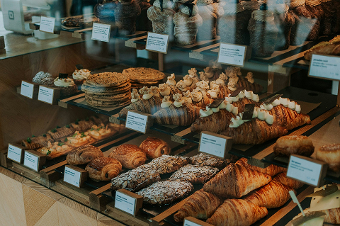 baked goods in a display case at a bakery in Plano, TX