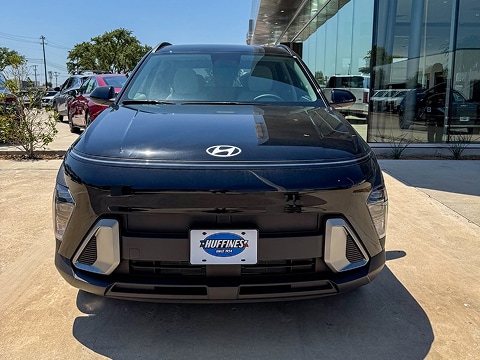 black 2026 Hyundai Kona EV parked at the Huffines Hyundai Plano dealership in Plano, TX