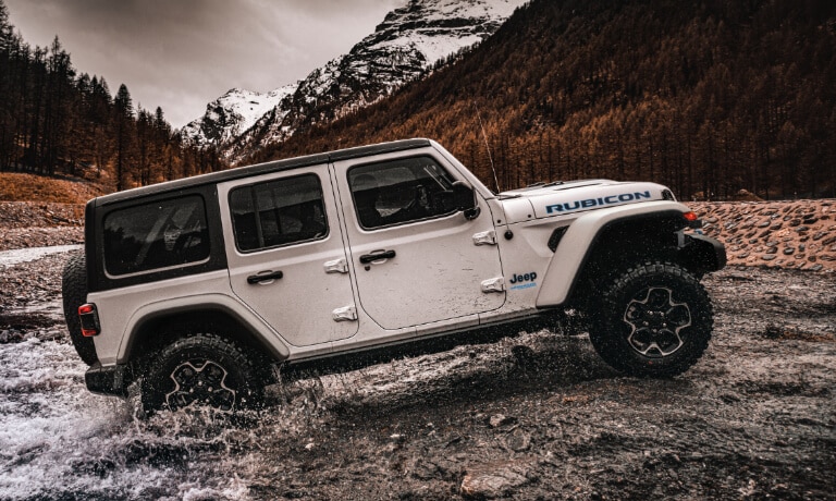 2023 Jeep Wrangler offroading in a stream