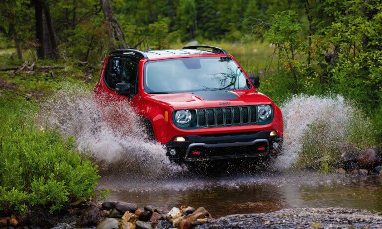 2022 Jeep Renegade driving through a stream