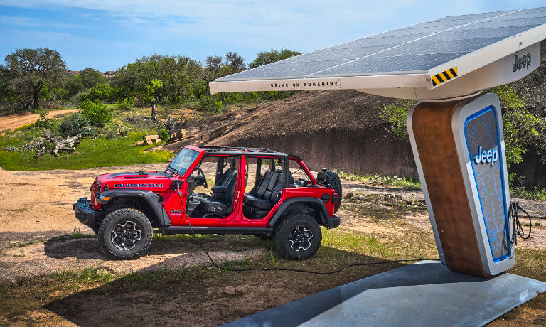 2023 Jeep Wrangler 4xe with doors off at solar charging station