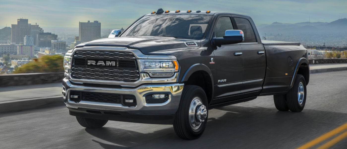 2024 Ram 3500 driving on a highway in city