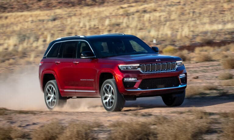 2025 Jeep Grand Cherokee driving in desert field