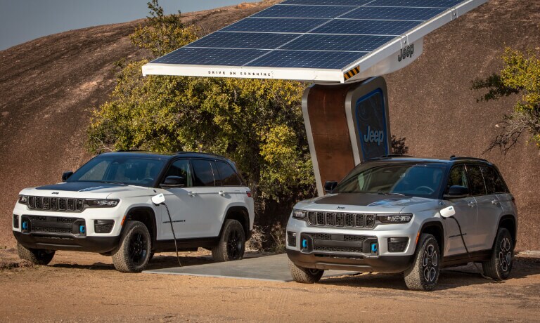 2024 Jeep Grand Cherokee 4xe charging at a station