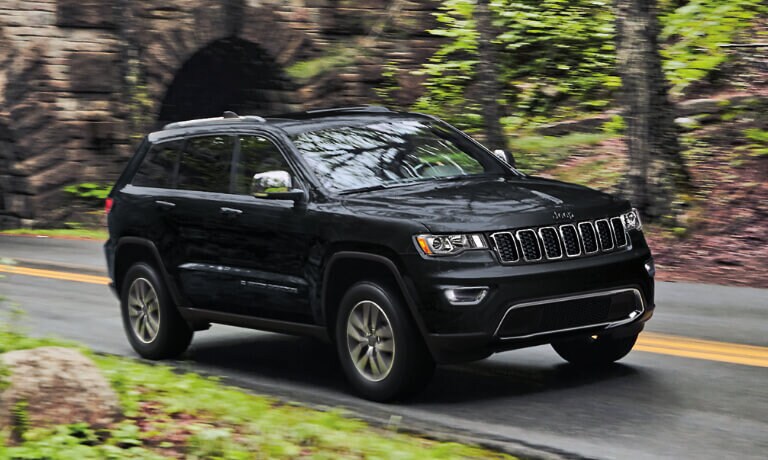 2022 Jeep Grand Cherokee driving out of a tunnel