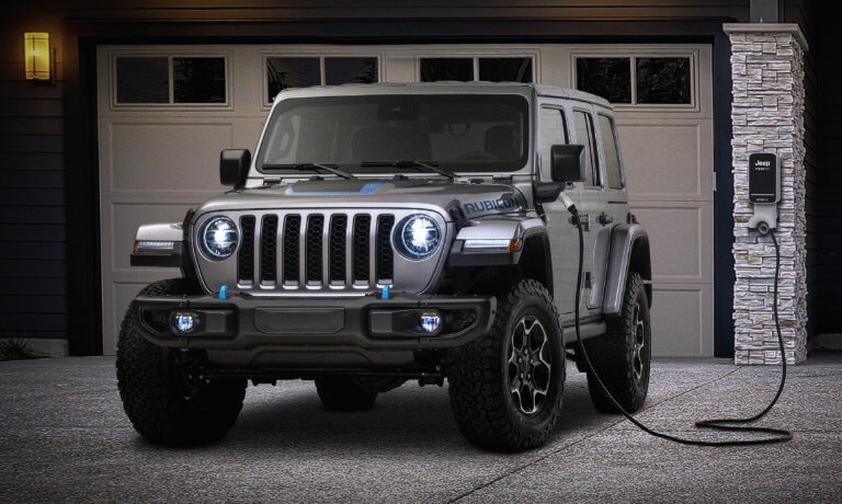 2023 Jeep Wrangler 4xe charging on a driveway