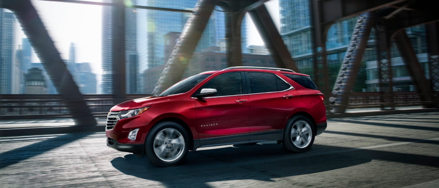 2021 Chevy Equinox driving on a city bridge