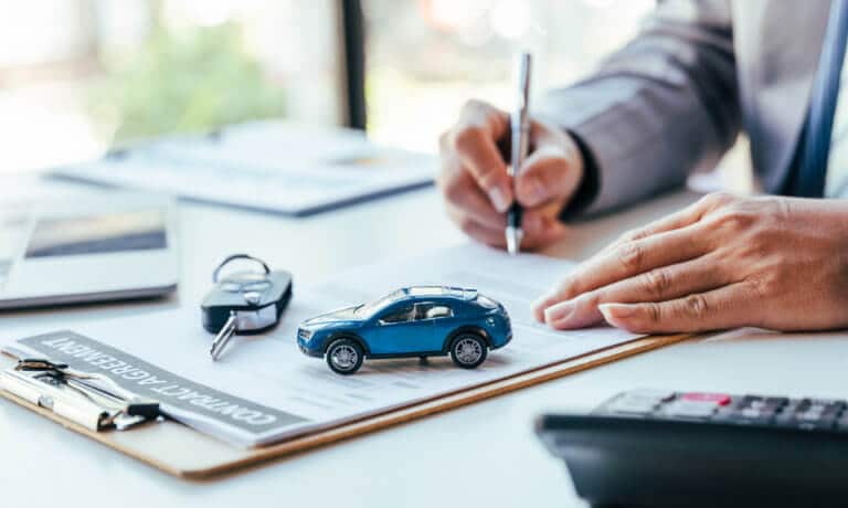 Signing a finance contract with tiny car