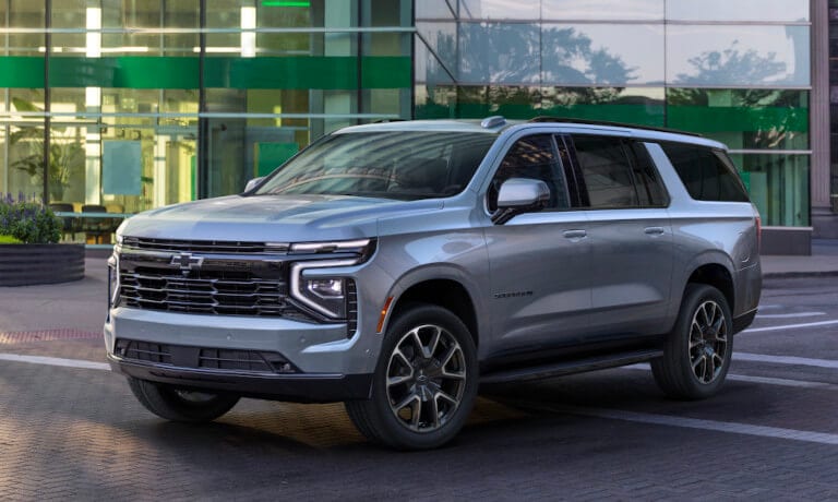 2025 Chevy Suburban parked by an office building