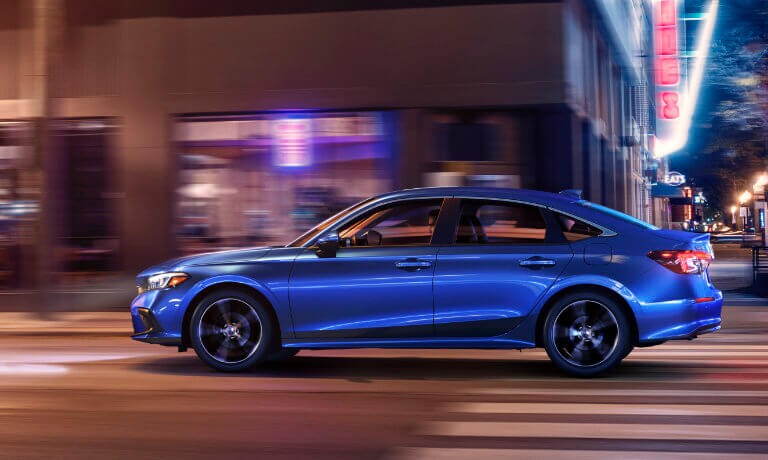 2022 Honda Civic driving in the city at night