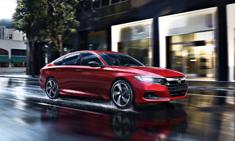 2022 Honda Accord driving on a wet road