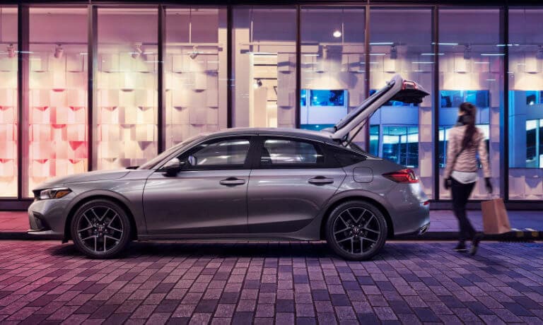 2022 Honda Civic Hatckback parked in front of a store