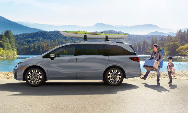 2025 Honda Odyssey parked by a lake