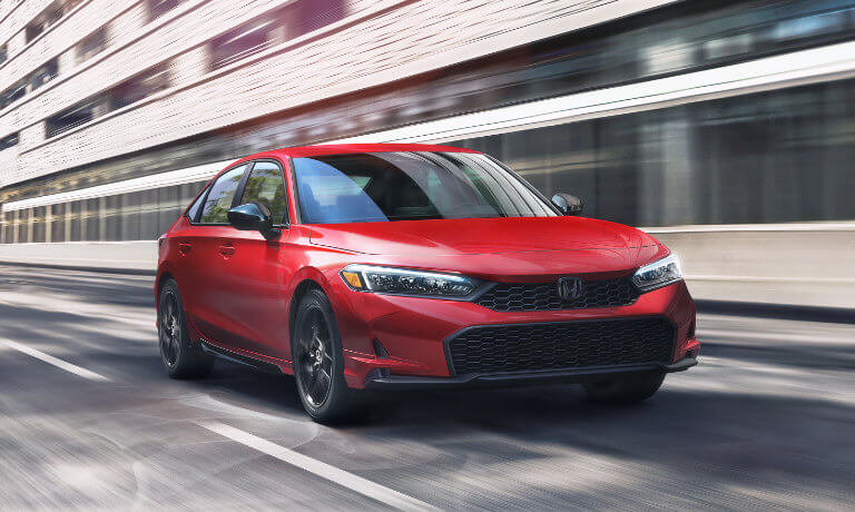 2025 Honda Civic Sedan driving through the city