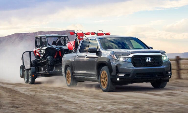 2022 Honda Ridgeline towing an ATV