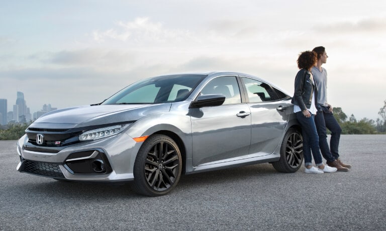 2021 Honda Civic exterior couple leaning up against Civic