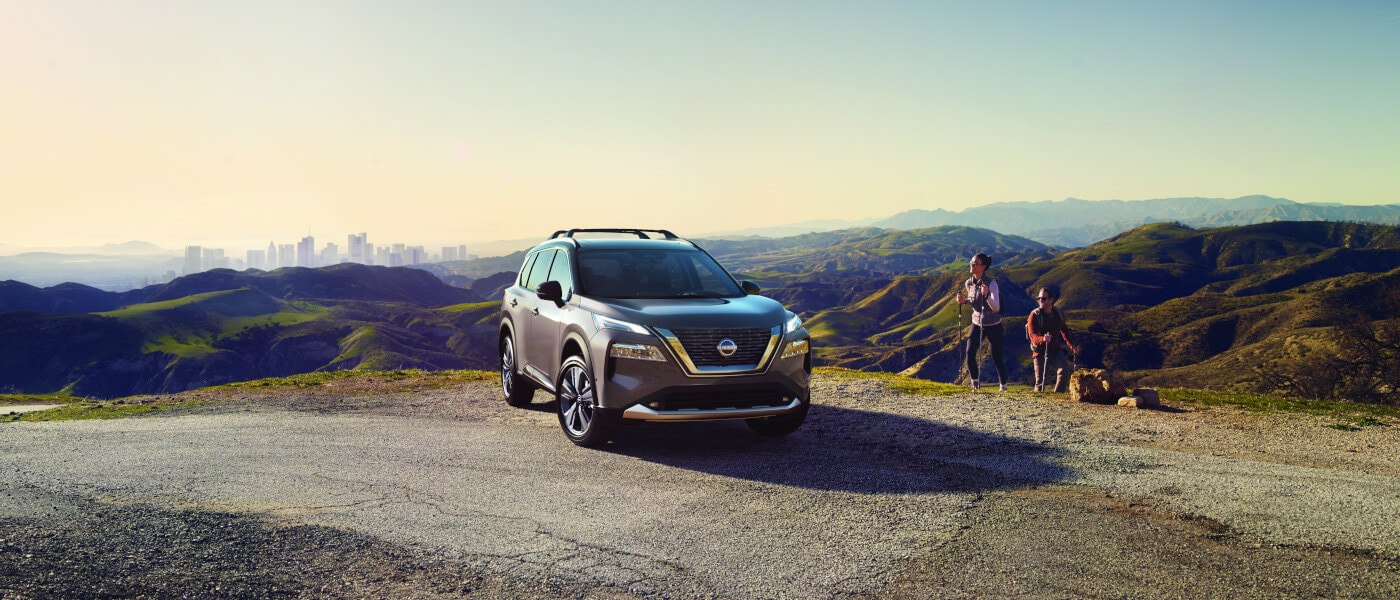 2023 Nissan Rogue in mountains with hikers