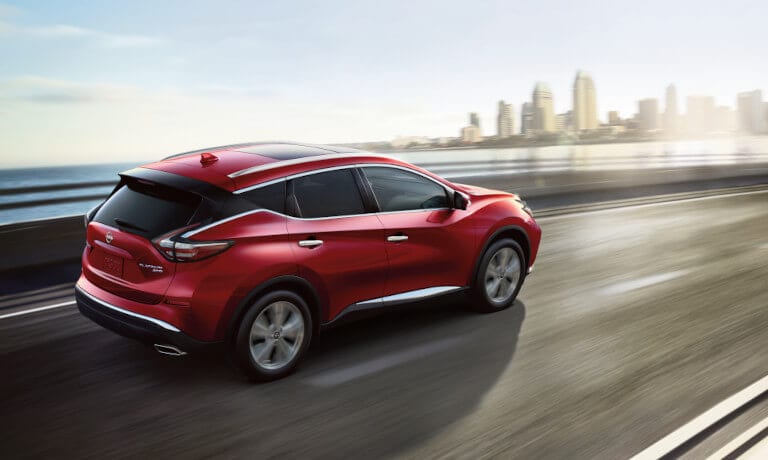 2023 Nissan Murano driving fast toward the city