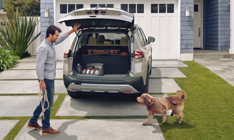 2022 Nissan Rogue with trunk open and a good boy ready for a walk