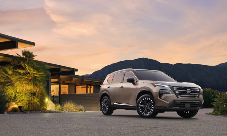 2026 Nissan Rogue parked outside a home
