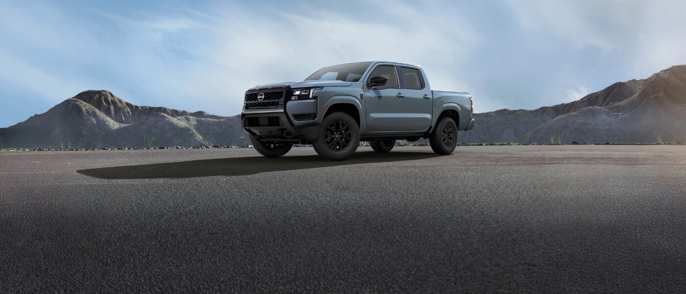 2026 Nissan Frontier side view parked in mountains