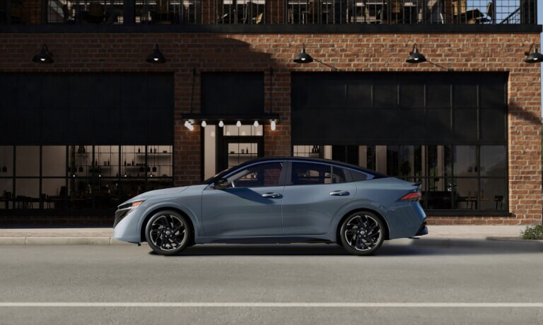 2026 Nissan Sentra side view parked outside building