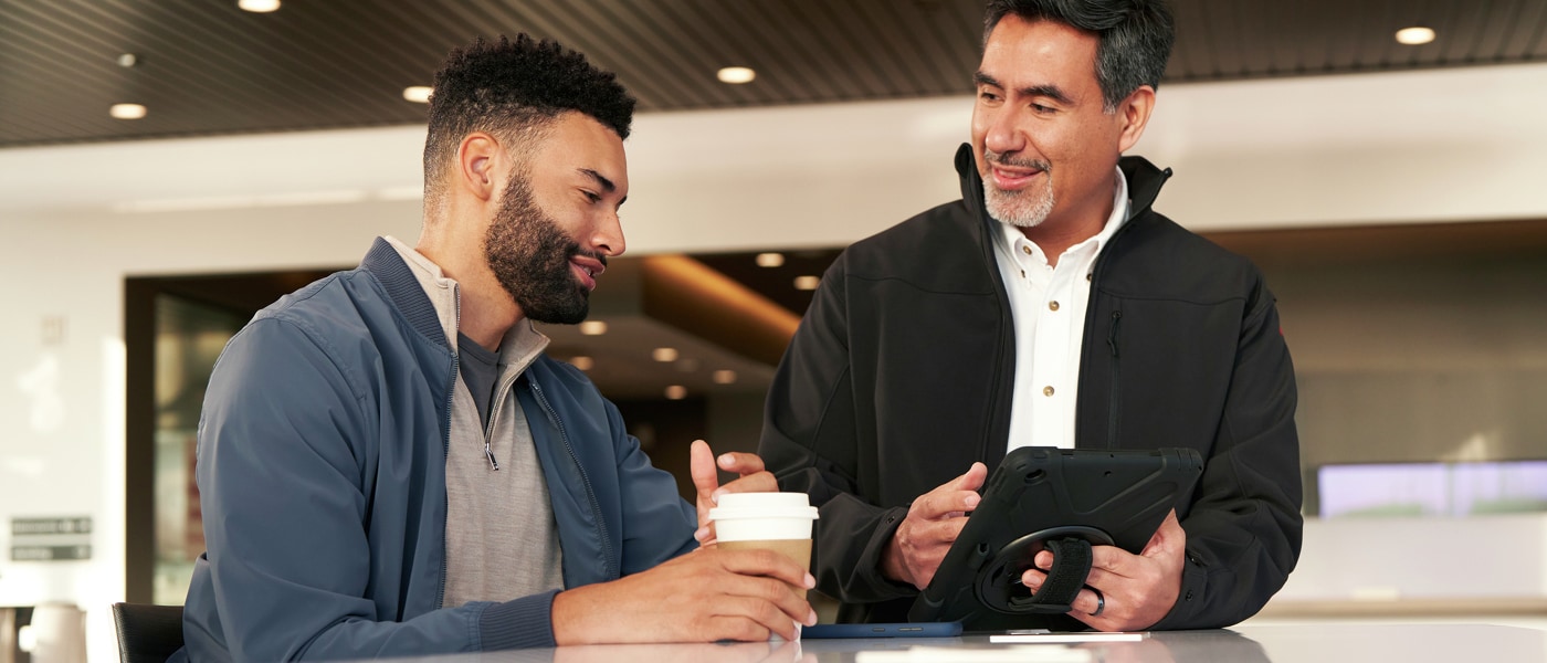 Nissan-specialist-sitting-with-customer-at-table