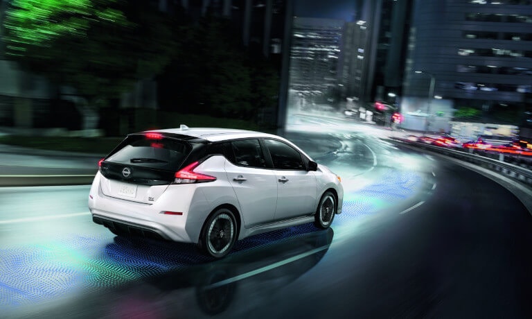 2024 Nissan LEAF driving on curved city road