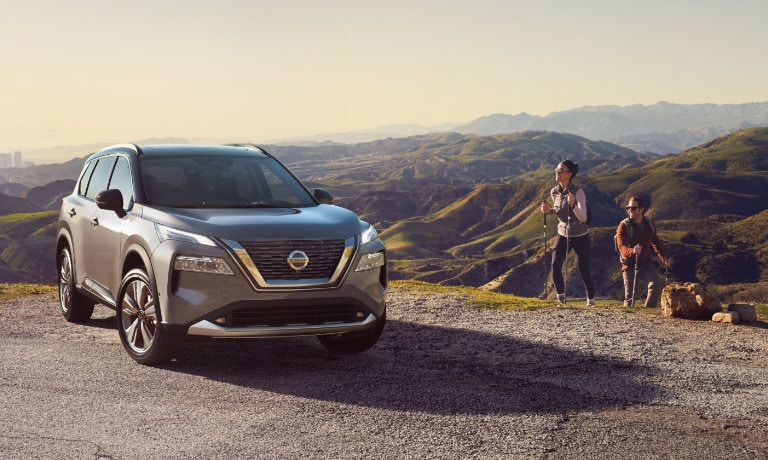2022 Nissan Rogue in the hills with hikers
