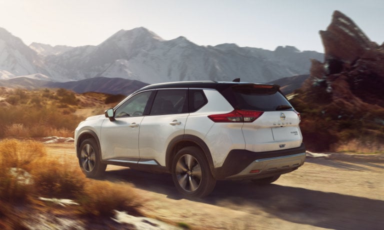 2022 Nissan Rogue driving in the desert mountains