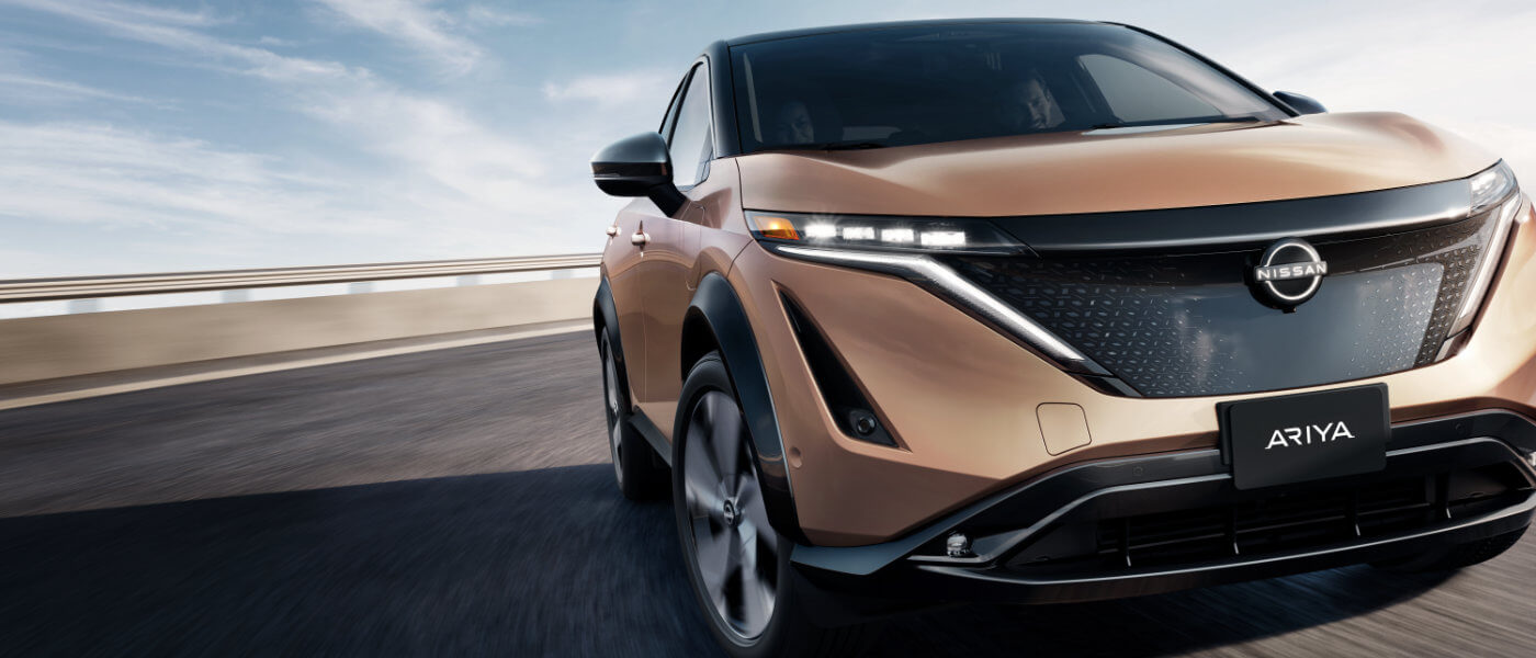 2024 Nissan ARIYA driving close-up on a curved road