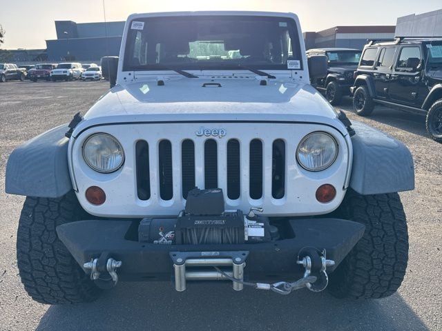Used 2012 Jeep Wrangler Sport with VIN 1C4AJWAG9CL101055 for sale in Huntington Beach, CA