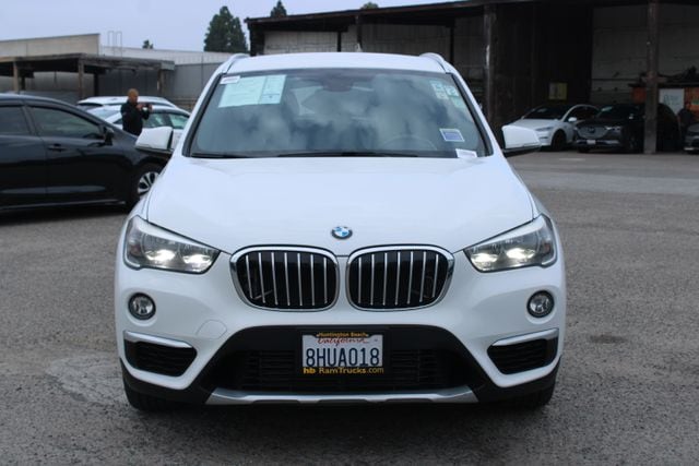 Used 2018 BMW X1 28i with VIN WBXHU7C37J5L09106 for sale in Huntington Beach, CA