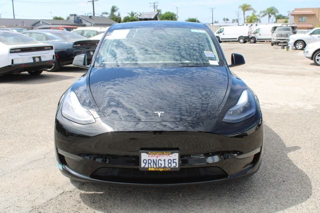 Used 2025 Tesla Model Y Long Range with VIN 7SAYGDED6SF273548 for sale in Huntington Beach, CA