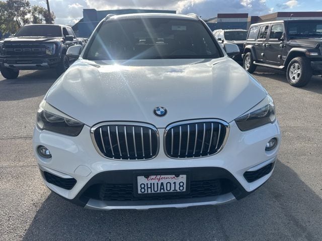 Used 2018 BMW X1 28i with VIN WBXHU7C37J5L09106 for sale in Huntington Beach, CA