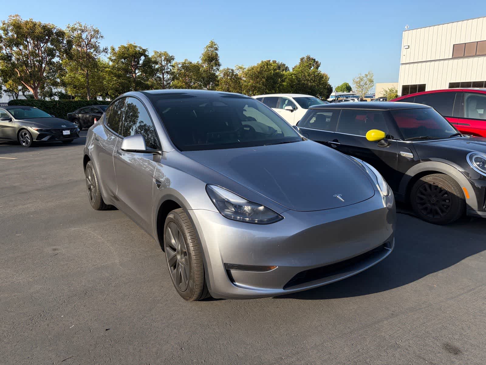 Used 2025 Tesla Model Y Long Range with VIN 7SAYGDEE3SA344906 for sale in Huntington Beach, CA