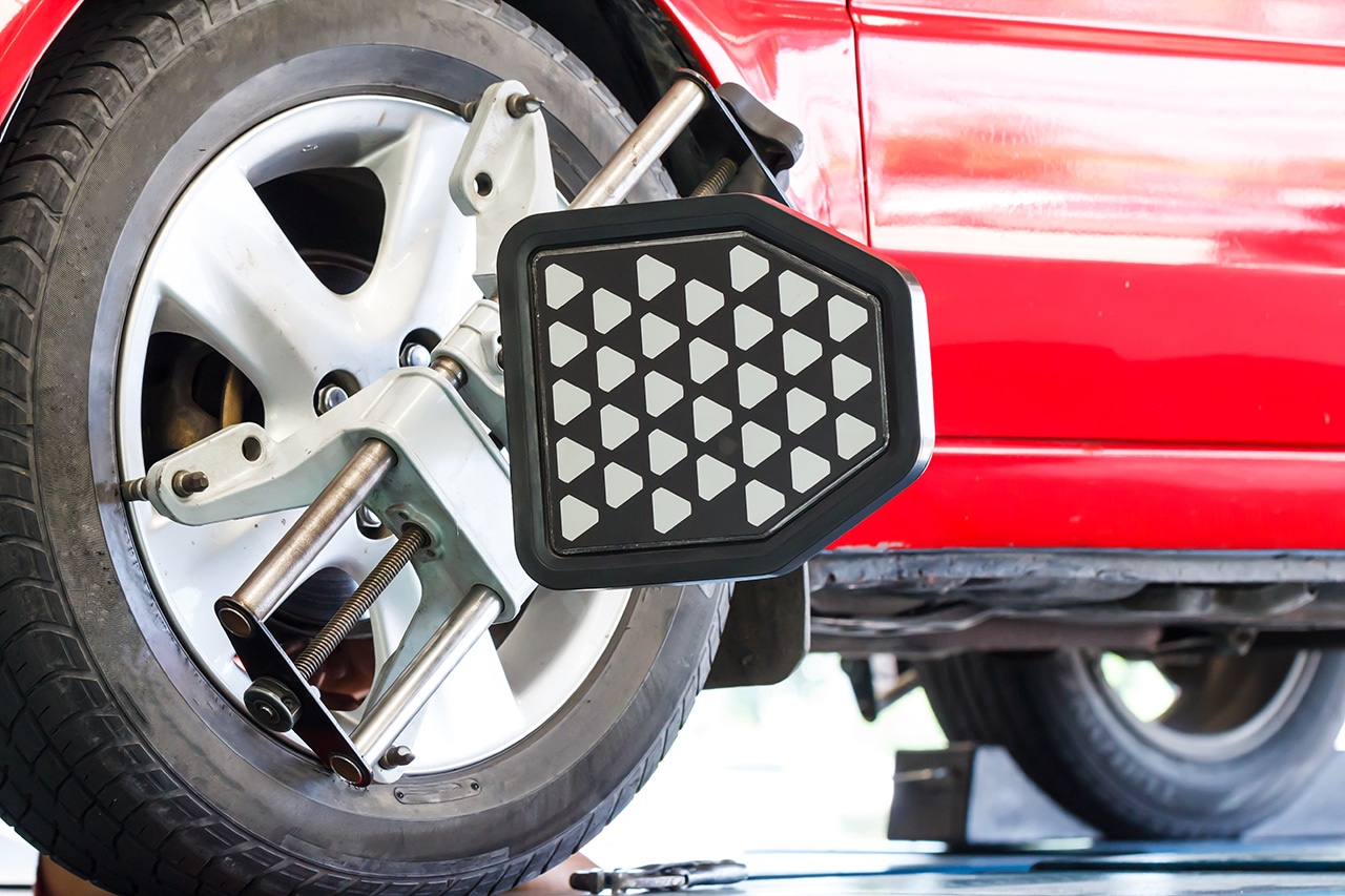Technician performing Hyundai wheel alignment