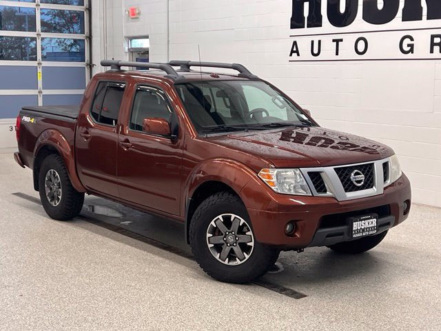 Orange 2016 Nissan Frontier Pickup Truck Four-Wheel Drive Automatic