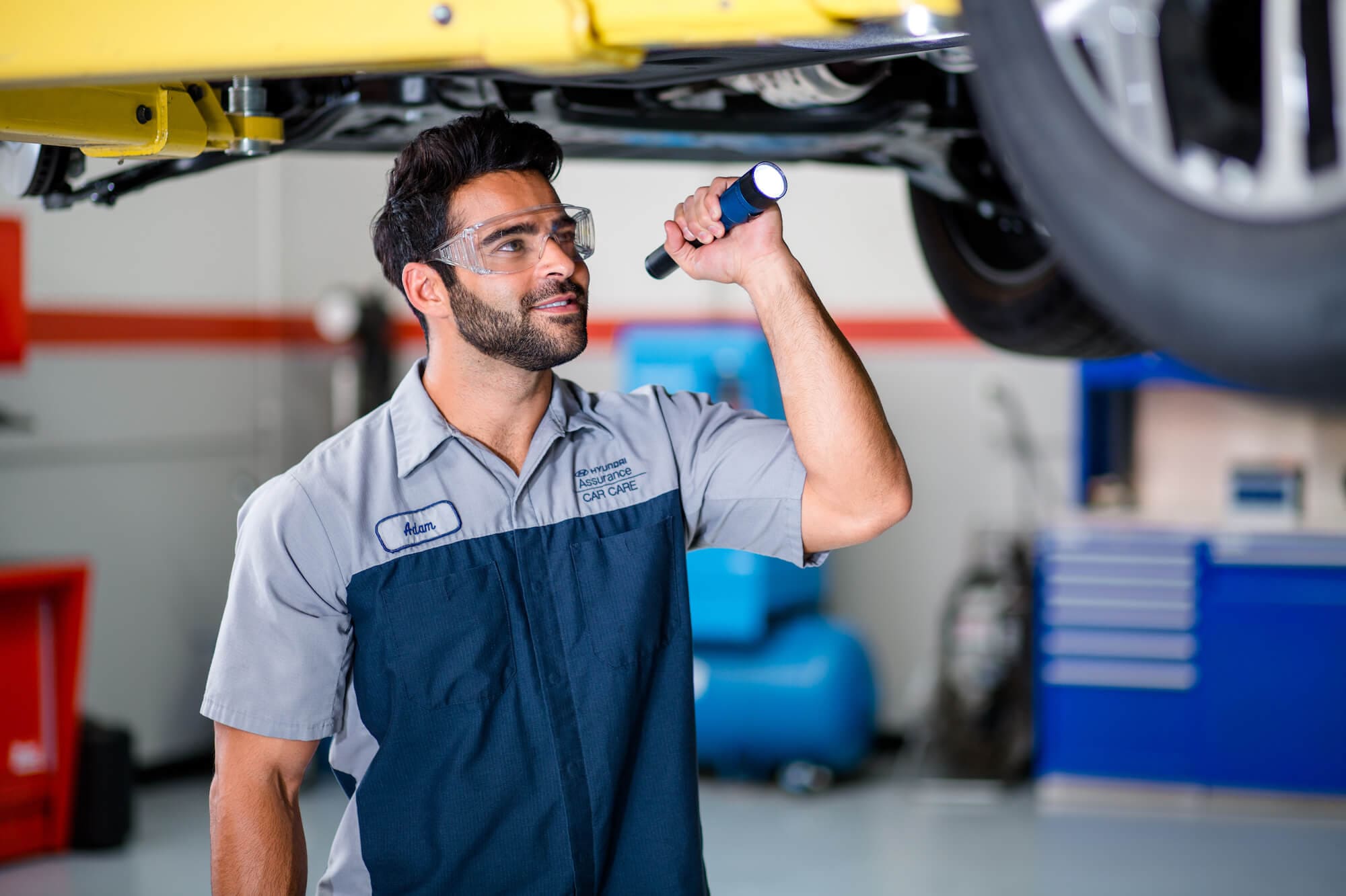 Hyundai of Central Florida - Service Technician Inspecting Brakes